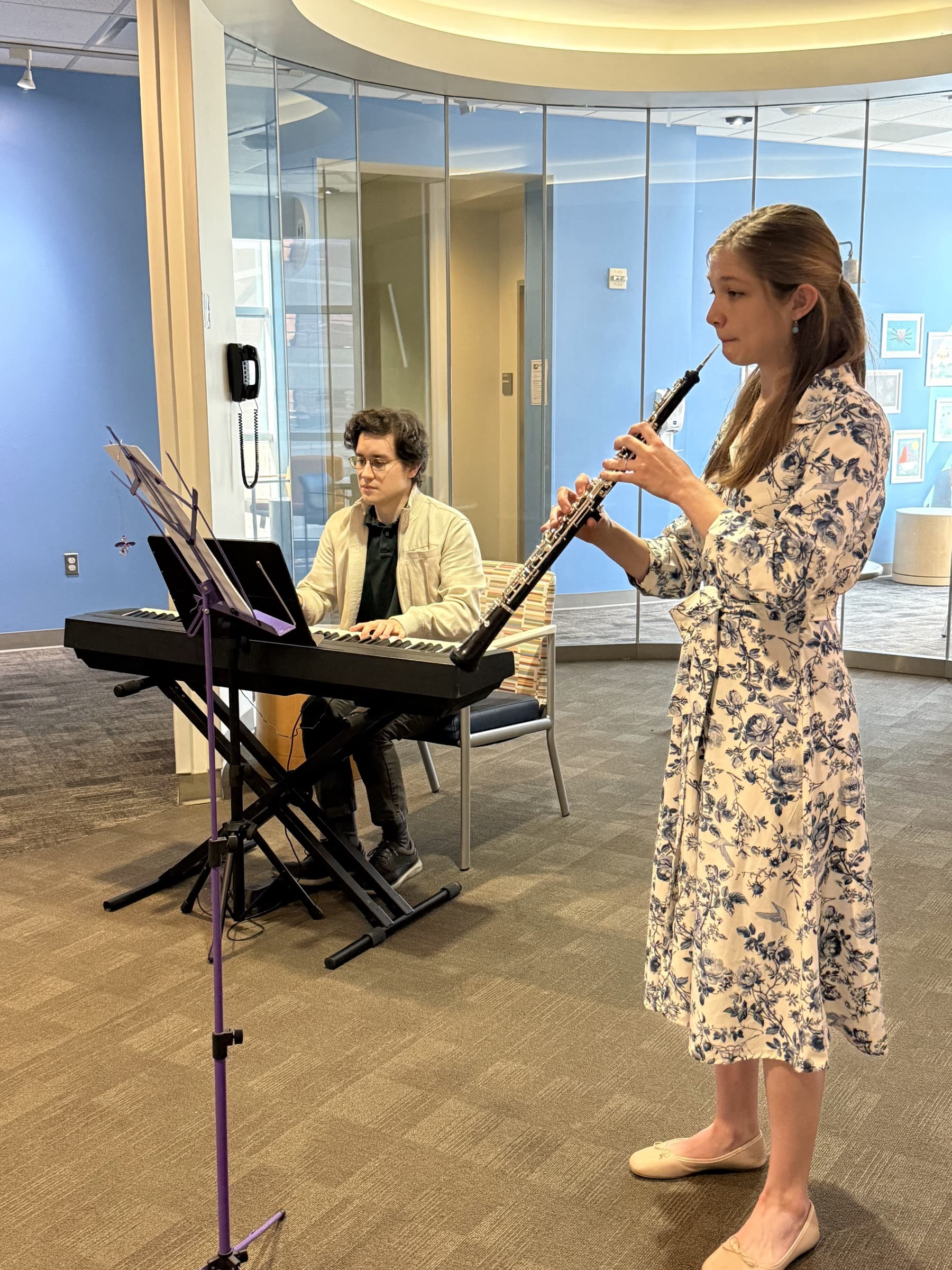 An oboist and pianist performing at Houston Children’s Hospital